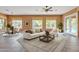 Bright living room with neutral decor, large windows, and a view of the pool at 844 E County Down Dr, Chandler, AZ 85249