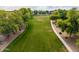 Large park area featuring a long pathway and many trees at 844 E County Down Dr, Chandler, AZ 85249
