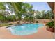 Private backyard pool featuring a unique shape, tile accents, and a surrounding patio at 844 E County Down Dr, Chandler, AZ 85249
