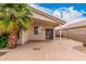View of the back patio featuring a covered area, desert landscaping, and access to the home at 1019 N Monterey St, Gilbert, AZ 85233