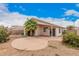 Backyard showcasing a patio area, desert landscaping, and a view of the home's exterior at 1019 N Monterey St, Gilbert, AZ 85233