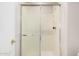 Bathroom shower featuring glass sliding doors and updated fixtures at 1019 N Monterey St, Gilbert, AZ 85233
