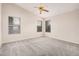 Bright bedroom features neutral carpet, paint, multiple windows and ceiling fan at 1019 N Monterey St, Gilbert, AZ 85233
