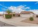 Charming single-Gathering home featuring a two-car garage, desert landscaping, and a tile roof at 1019 N Monterey St, Gilbert, AZ 85233