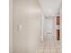 Hallway with tile floor, neutral paint and a light switch at 1019 N Monterey St, Gilbert, AZ 85233