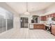 Bright eat-in kitchen includes stainless steel appliances, sliding doors and large window at 1019 N Monterey St, Gilbert, AZ 85233