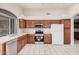 Kitchen features updated appliances, tile flooring, ample cabinet space and natural light at 1019 N Monterey St, Gilbert, AZ 85233
