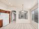 Eat-in kitchen features tile flooring, open to the living room, and updated appliances at 1019 N Monterey St, Gilbert, AZ 85233