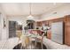 Bright eat-in kitchen featuring stainless steel appliances, wooden cabinets, and a cozy dining area with backyard access at 1019 N Monterey St, Gilbert, AZ 85233
