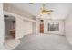 Bright living room with new carpet, vaulted ceilings and decorative ceiling fans at 1019 N Monterey St, Gilbert, AZ 85233