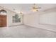Spacious living room with carpet flooring, high ceilings, and natural light at 1019 N Monterey St, Gilbert, AZ 85233