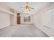Spacious living room with carpet flooring, high ceilings, and natural light at 1019 N Monterey St, Gilbert, AZ 85233