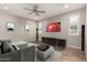Cozy living room featuring modern furniture, a ceiling fan, and plenty of natural light at 10307 E Tiburon Ave, Mesa, AZ 85212