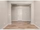 Bright, neutral living area featuring hardwood flooring, light gray walls, and white trim at 10307 E Tiburon Ave, Mesa, AZ 85212