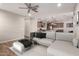 Open-concept living room flows seamlessly into the kitchen, with stylish furnishings and finishes at 10307 E Tiburon Ave, Mesa, AZ 85212