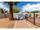 Charming backyard features a storage shed and desert landscaping at 10358 N 78Th Ave, Peoria, AZ 85345