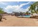 Expansive backyard with refreshing pool, desert landscaping, and relaxing lounge areas at 10358 N 78Th Ave, Peoria, AZ 85345
