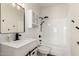 Bathroom featuring black hardware, new sink, and shower-tub combo at 10358 N 78Th Ave, Peoria, AZ 85345