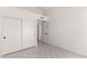 A bright room features tile floors, a closet and a door to another room at 10358 N 78Th Ave, Peoria, AZ 85345