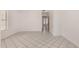 Bright bedroom with neutral tile flooring and closet, creating a cozy and comfortable atmosphere for relaxation and rest at 10358 N 78Th Ave, Peoria, AZ 85345