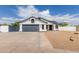 Charming single-story home with a two-car garage, gravel landscaping, and a well-maintained front yard at 10358 N 78Th Ave, Peoria, AZ 85345