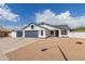 Charming single-story home with a two-car garage, gravel landscaping, and a well-maintained front yard at 10358 N 78Th Ave, Peoria, AZ 85345