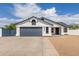 Charming single-story home with a two-car garage, gravel landscaping, and a well-maintained front yard at 10358 N 78Th Ave, Peoria, AZ 85345