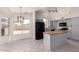 Bright kitchen with custom island, modern appliances, and plenty of natural light at 10358 N 78Th Ave, Peoria, AZ 85345