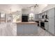 The spacious kitchen features sleek appliances, ample counter space, and a central island at 10358 N 78Th Ave, Peoria, AZ 85345