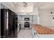 Kitchen featuring updated appliances, a custom island, and plenty of room for cooking at 10358 N 78Th Ave, Peoria, AZ 85345