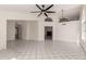 Bright living room features fireplace, tile floors, and open floorplan, creating an inviting space for relaxation and entertaining at 10358 N 78Th Ave, Peoria, AZ 85345