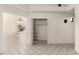 Bright living area with tile flooring and a closet for storage at 10358 N 78Th Ave, Peoria, AZ 85345