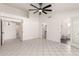 This main bedroom features an open layout and tile flooring at 10358 N 78Th Ave, Peoria, AZ 85345