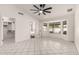 A spacious main bedroom with tile flooring, a walk-in closet, and large windows at 10358 N 78Th Ave, Peoria, AZ 85345