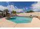 Beautiful backyard pool with desert landscaping, rock waterfall and firepit at 10358 N 78Th Ave, Peoria, AZ 85345
