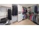 Organized walk-in closet featuring custom shelving, hanging rods, and ample storage space at 10613 E Nacoma Dr, Sun Lakes, AZ 85248