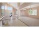 Bright foyer boasts tile flooring, high ceilings, neutral walls, and decorative hanging light fixtures at 10613 E Nacoma Dr, Sun Lakes, AZ 85248