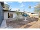 Backyard featuring desert landscaping and a covered patio at 10619 N 38Th Ave, Phoenix, AZ 85029
