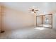 Neutral bedroom with ceiling fan, carpet and mirrored closet at 10619 N 38Th Ave, Phoenix, AZ 85029