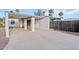 Spacious driveway and carport area, complemented by a partial view of the home's exterior at 10619 N 38Th Ave, Phoenix, AZ 85029