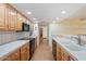 Spacious kitchen showcasing ample cabinet space, modern appliances, and a convenient breakfast bar at 10619 N 38Th Ave, Phoenix, AZ 85029