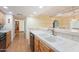 Bright kitchen featuring tile countertops, tile floors, sink with faucet, cabinets, and appliances at 10619 N 38Th Ave, Phoenix, AZ 85029