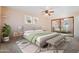 Serene main bedroom featuring a plush bed, stylish furnishings, and mirrored closet doors at 10619 N 38Th Ave, Phoenix, AZ 85029