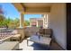 Relaxing outdoor balcony featuring stylish furniture and a tranquil ambiance at 11000 N 77Th Pl # 2042, Scottsdale, AZ 85260