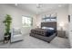Bright bedroom showcasing neutral tones, a comfortable chair, and ample natural light at 11000 N 77Th Pl # 2042, Scottsdale, AZ 85260