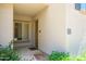 Inviting condo entrance with a well-maintained doorway, green plantings and unit numbers at 11000 N 77Th Pl # 2042, Scottsdale, AZ 85260