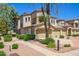 Beautifully landscaped townhouse featuring a three-car garage and manicured shrubs at 11000 N 77Th Pl # 2042, Scottsdale, AZ 85260