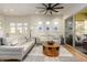 Spacious living area featuring neutral decor, contemporary furnishings and access to outdoor patio at 11000 N 77Th Pl # 2042, Scottsdale, AZ 85260