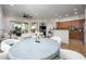 Inviting open-concept area with dining, kitchen bar, and a living space with a fireplace feature at 11000 N 77Th Pl # 2042, Scottsdale, AZ 85260