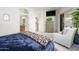 Stylish main bedroom with TV, dresser, comfortable chair, and relaxing decor at 11000 N 77Th Pl # 2042, Scottsdale, AZ 85260